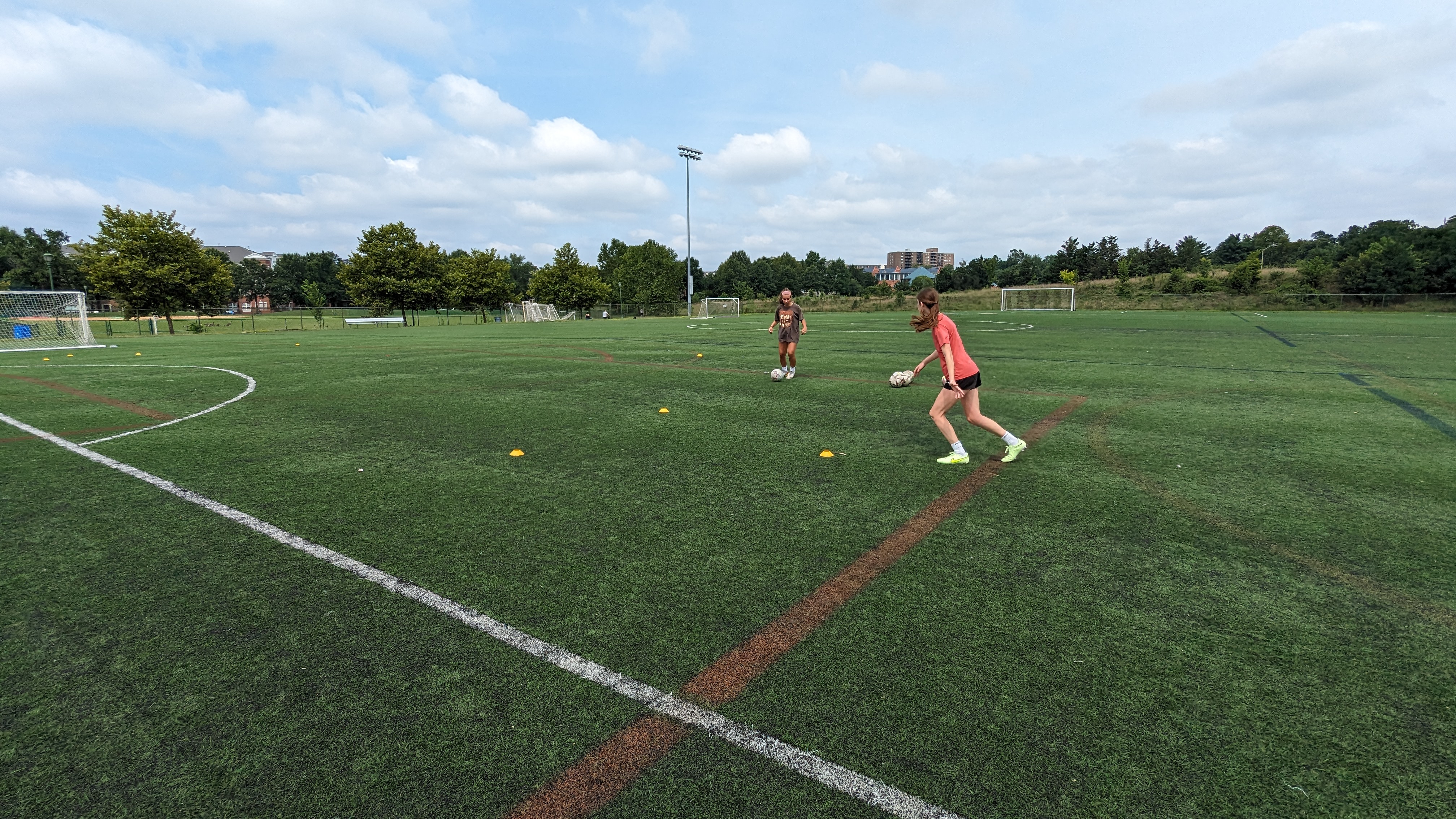 Two girls playing soccer