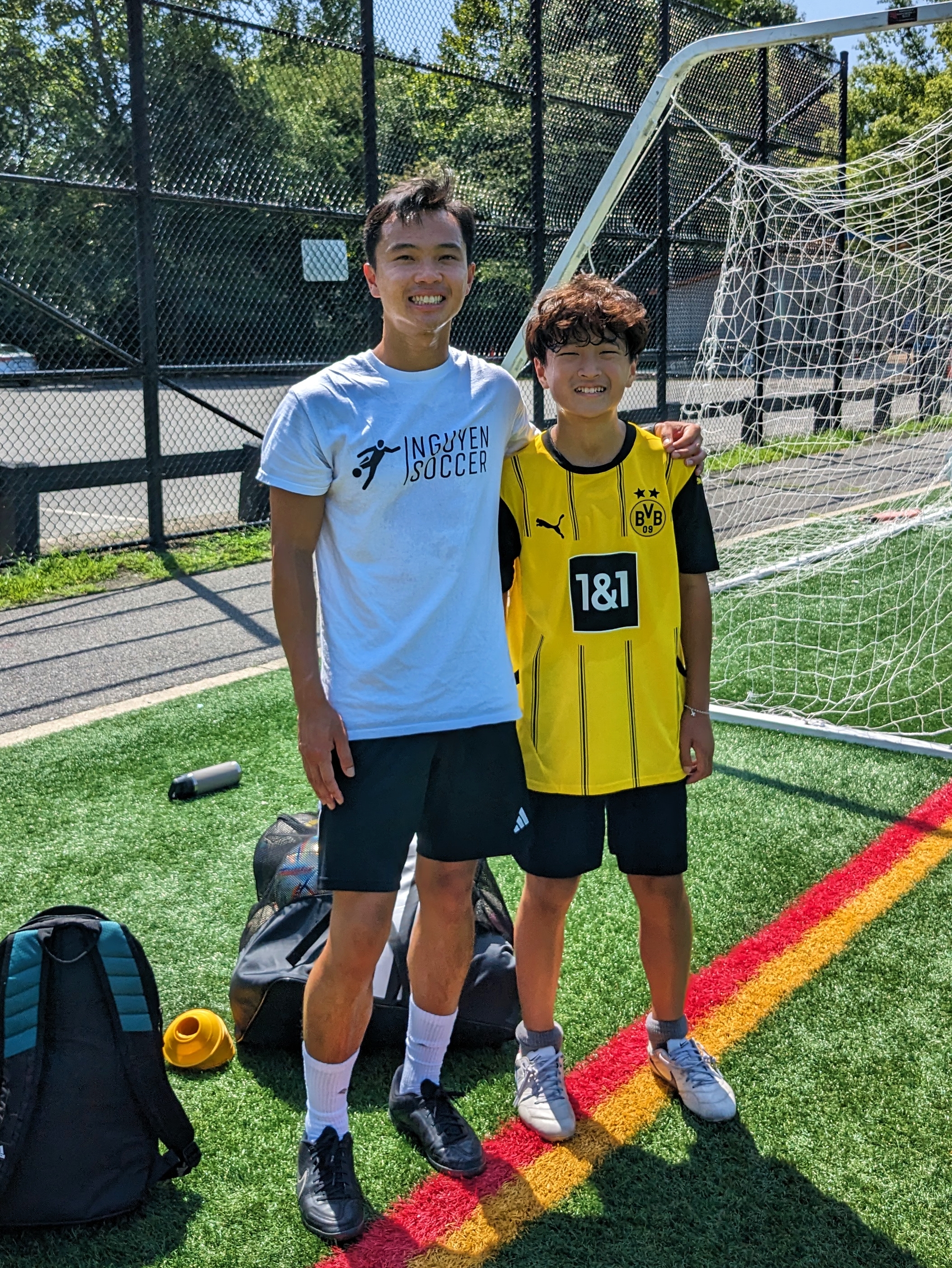 Soccer coach with player