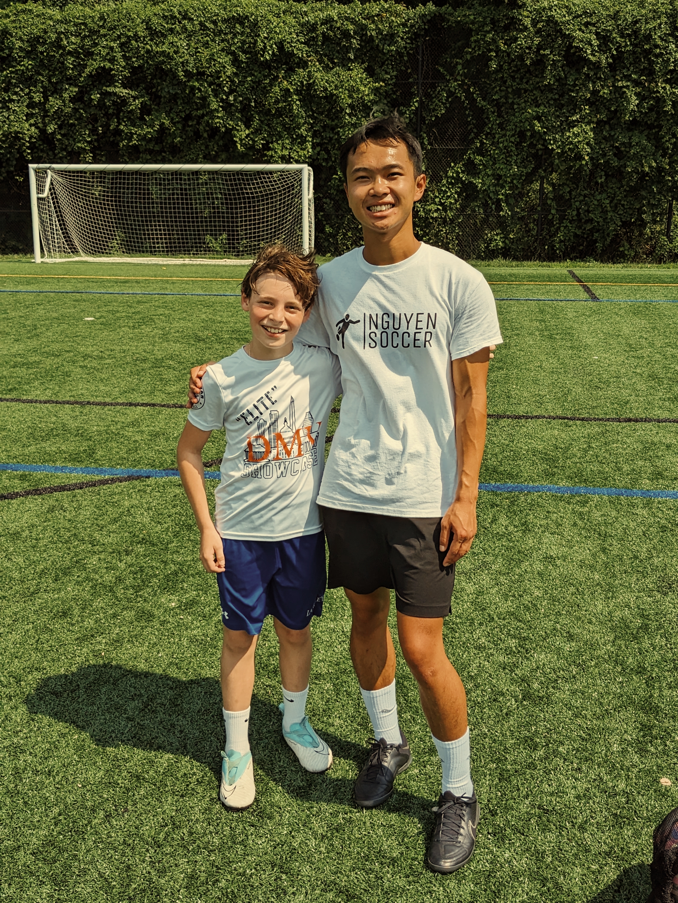 Soccer coach with player